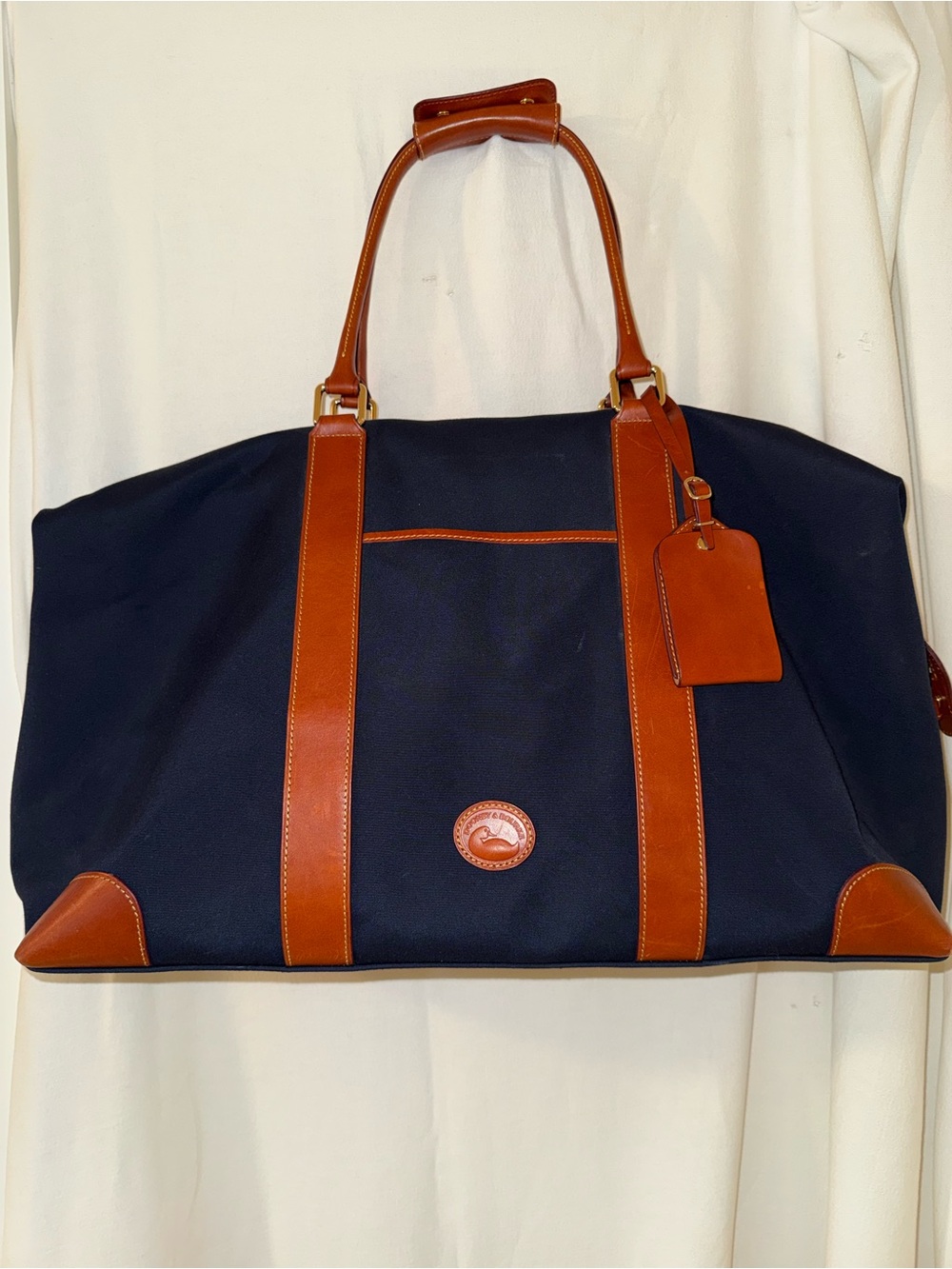Dooney & Bourke Getaway/Carry On Navy Canvas with Brown Leather Trim Bag